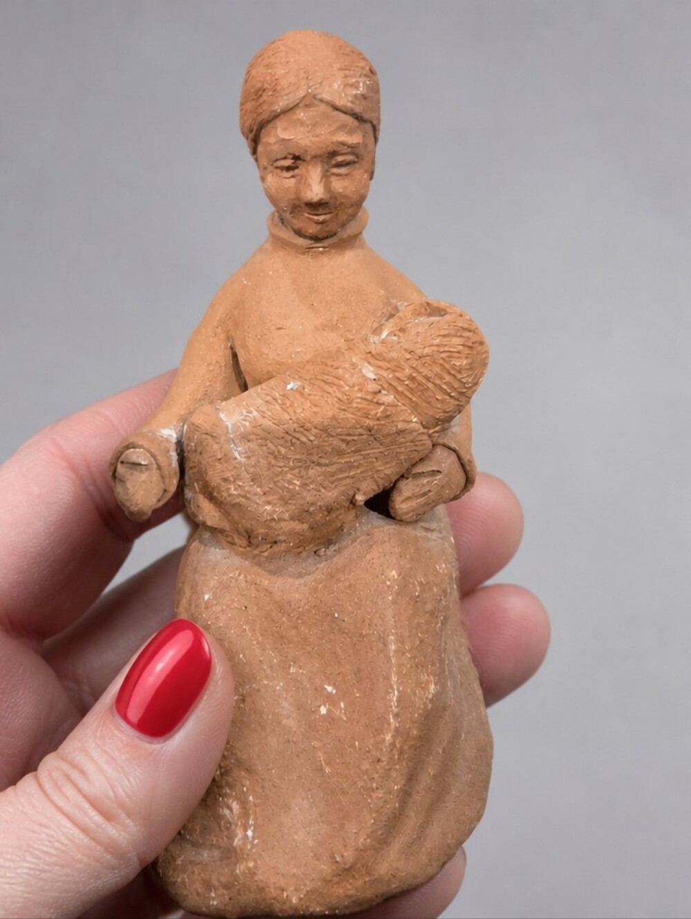 Handcrafted red clay figurine I a classic piece of Chilean folk art pottery 1980